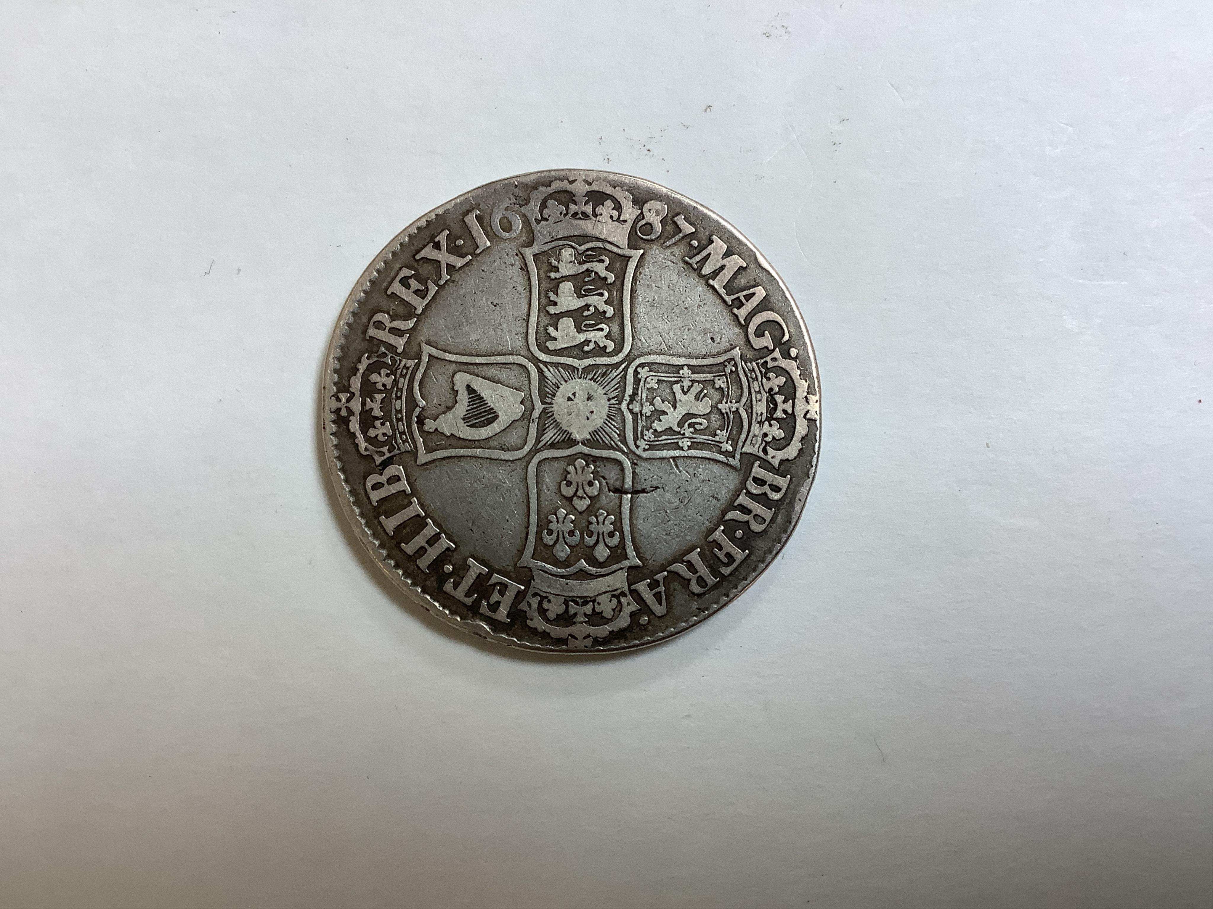 British silver coins, James II crown, 1687, scratch to portrait otherwise about fine